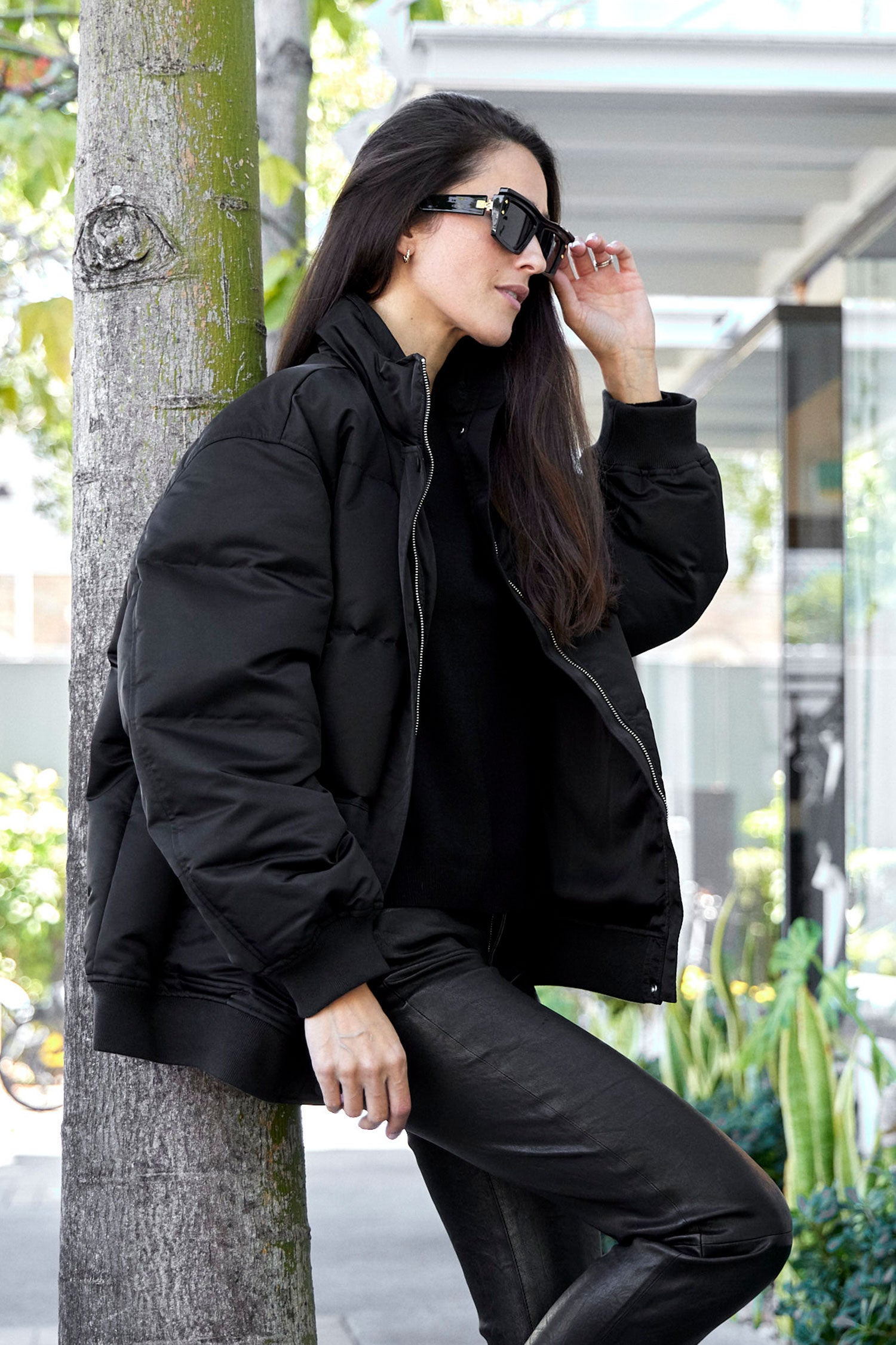 Black nylon store puffer jacket